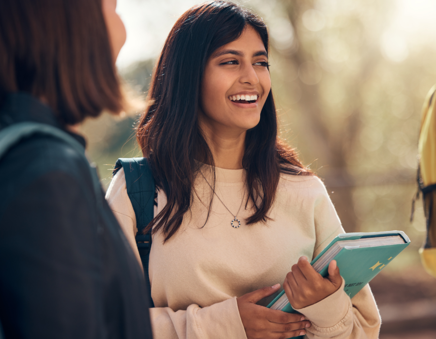 happy-books-or-indian-woman-student-with-friends-2022-12-29-22-42-19-utc 1